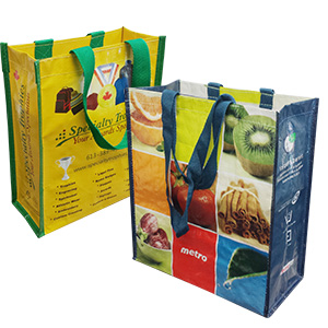 a pair of laminated woven bags with images on them