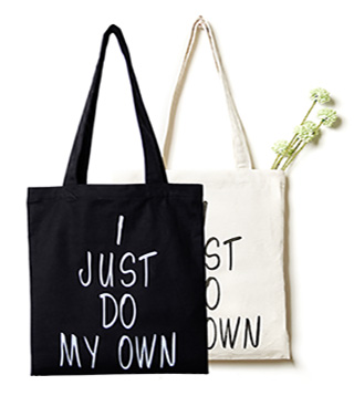 a black and a white canvas bags with text