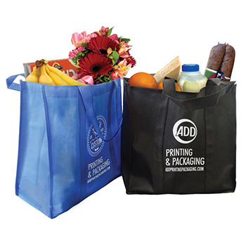 a blue and black non-woven shopping bags with logo on them and some food inside