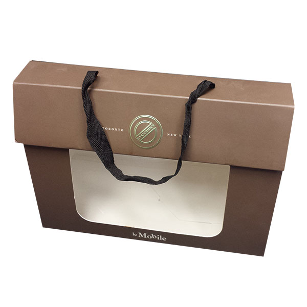 a brown gift box with a with ribbon handle