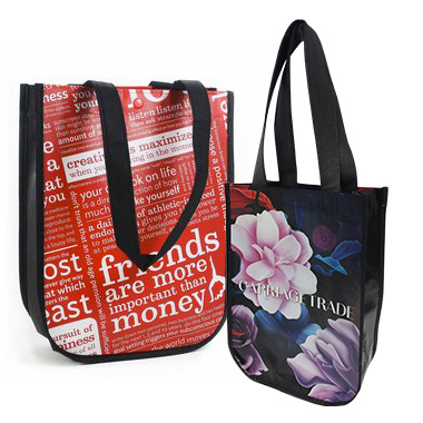 two reusable shopping bags one with flower design and one with text design
