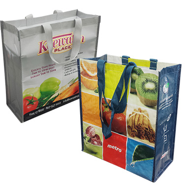 two laminated reusable shopping bags with different designs