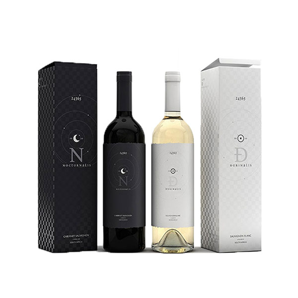 a black and a white wine bottles next to the wine boxes with same design