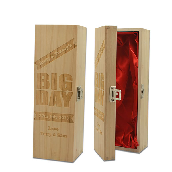 a wooden wine box with lock and a red cloth inside
