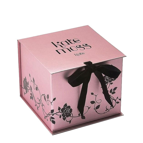 a pink gift box with black rose design and a black bow